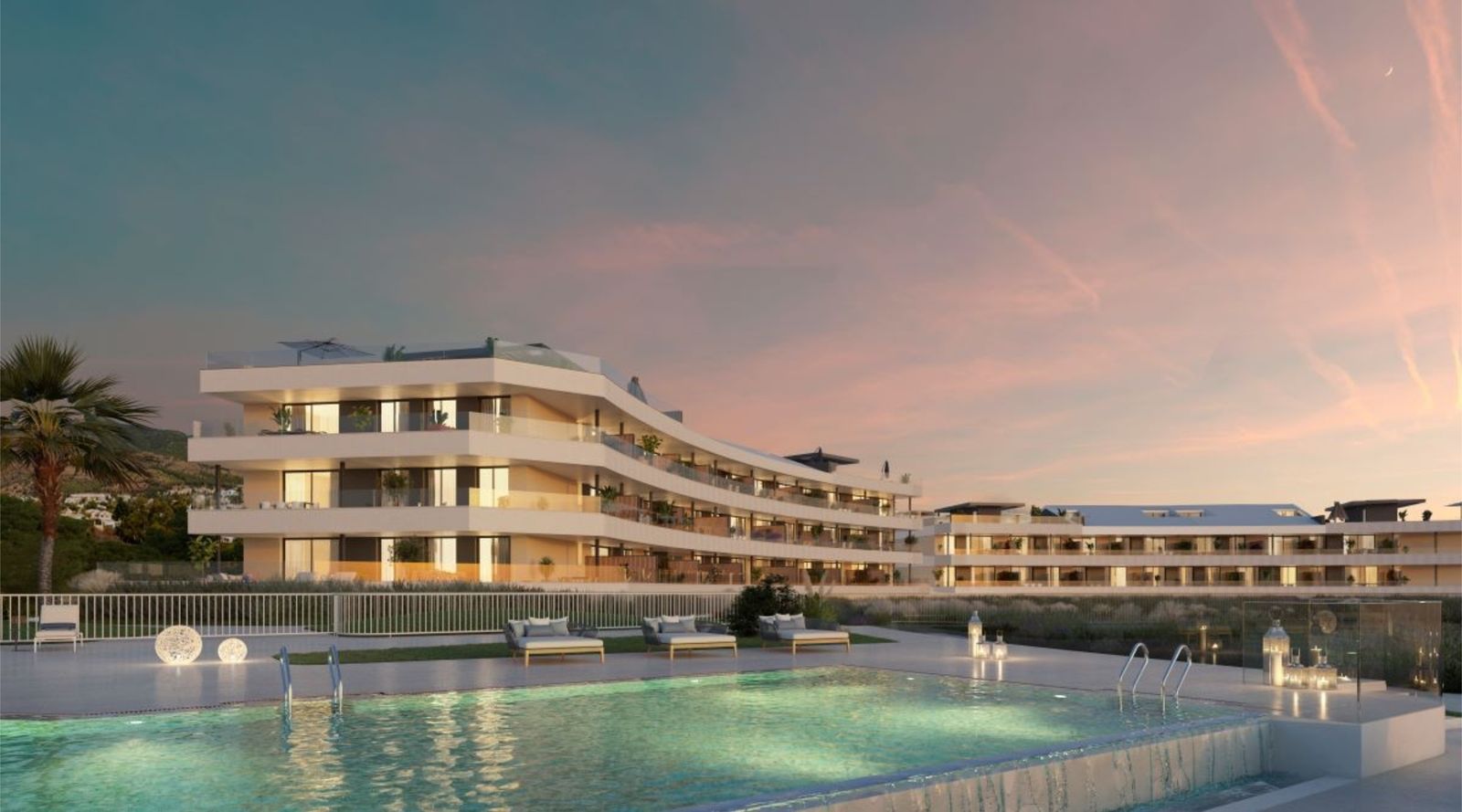 Luxe appartementen met zwembad bij zonsondergang